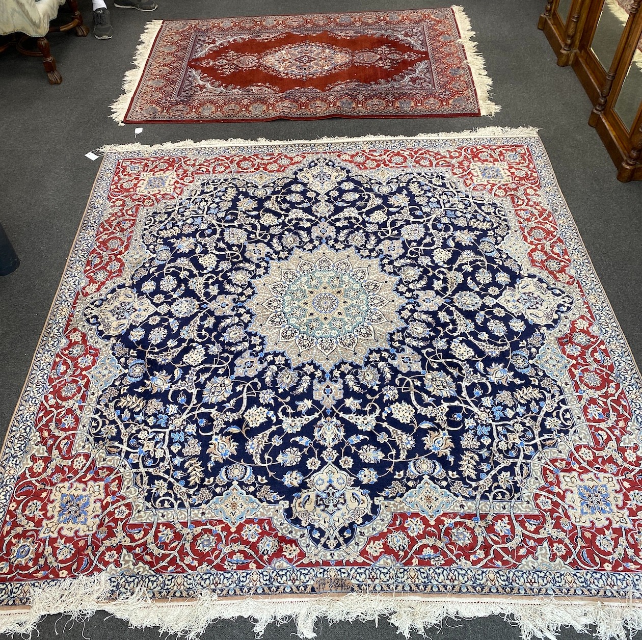 A North West Persian blue ground part silk rug, 220 x 217cm together with a similar smaller red ground rug